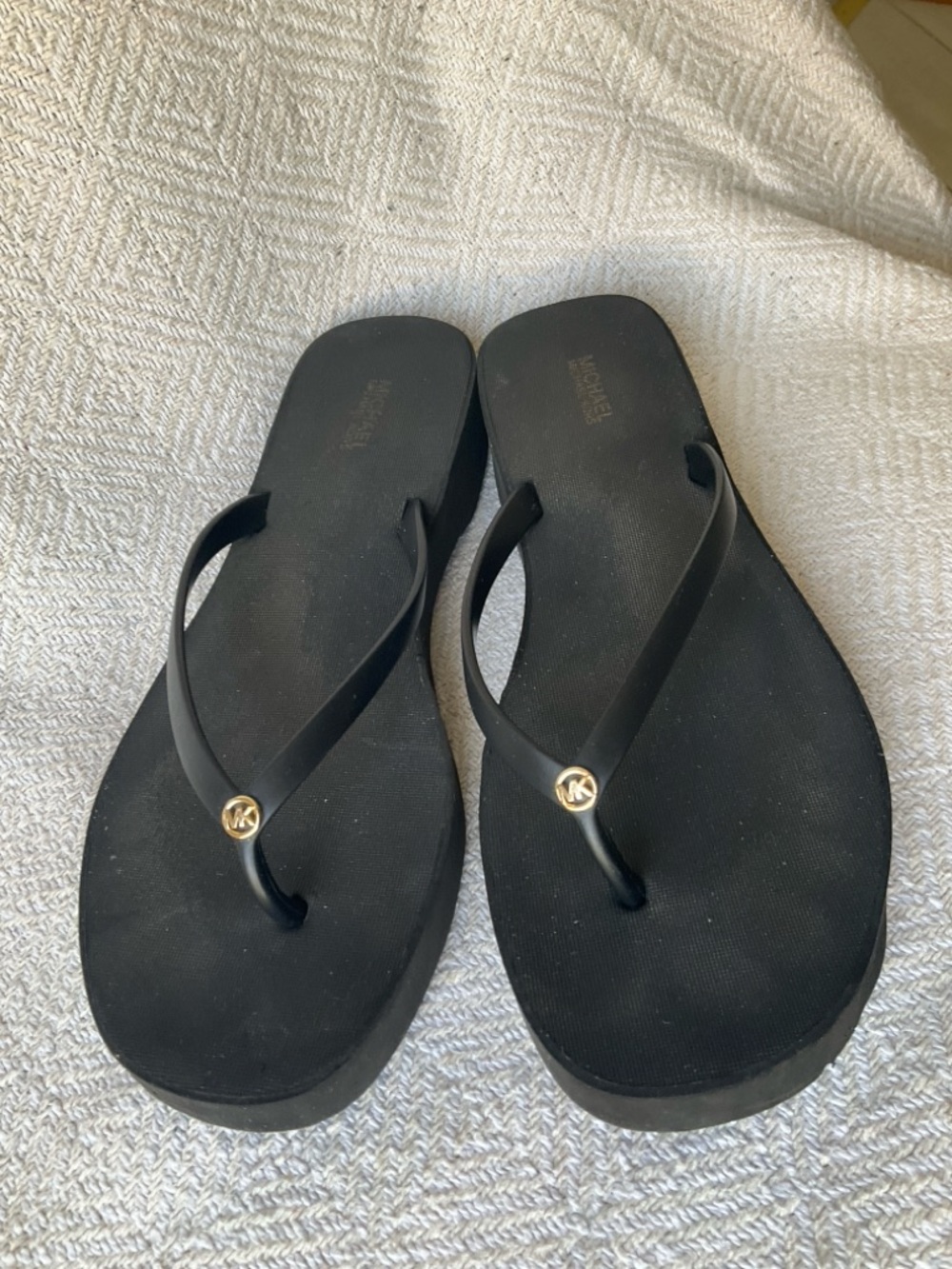 Michael Kors Black Flip Flops with Gold MK Charm
